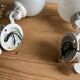Antique enamelled cast iron wall lights / opaline globe