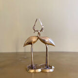Couple of brass intertwined herons