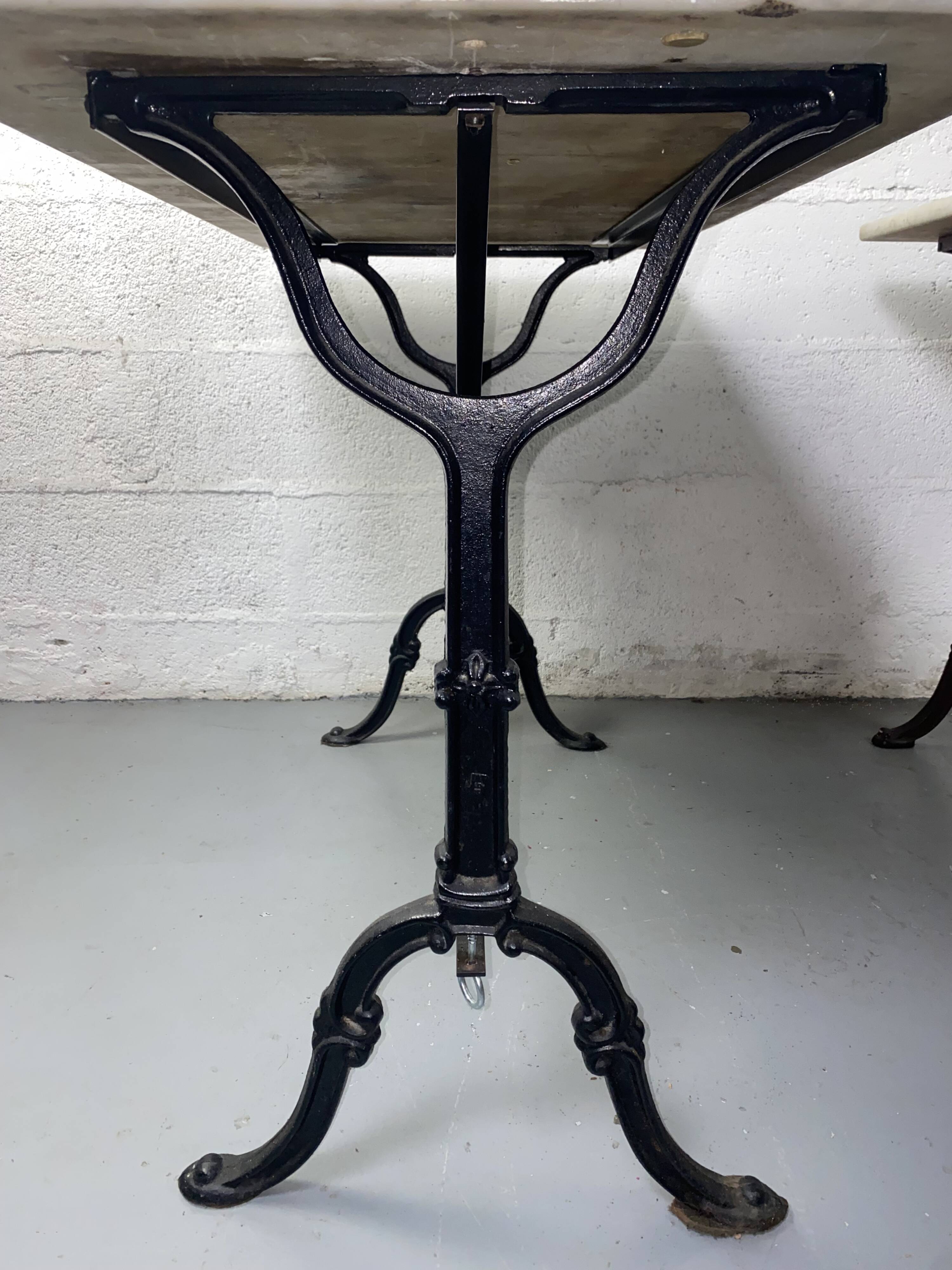 Set of two bistro tables in marble and wrought iron