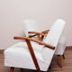 Vintage armchair in pearl white bouclé with walnut wood, 1960.
