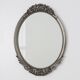 French Art Deco Oval Mirror with Carved Roses and Silver-Painted Frame