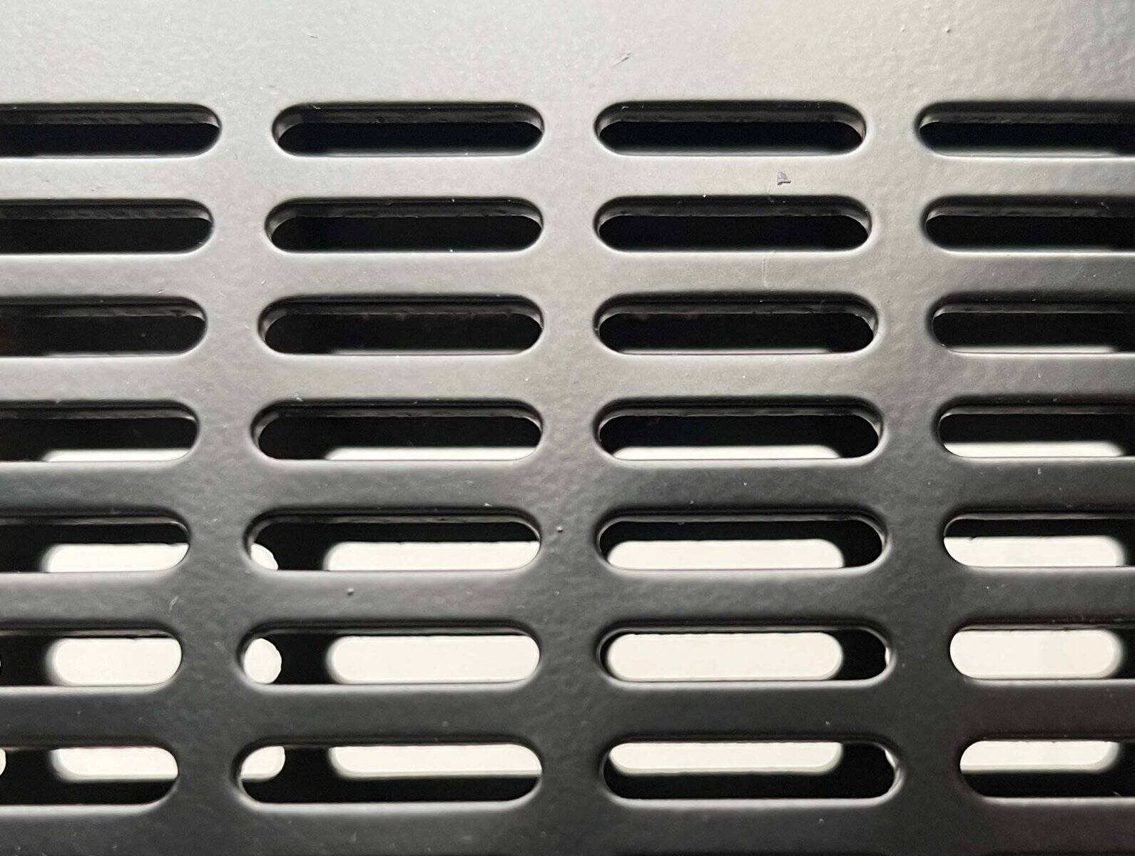 Postmodern black Quinta chair in perforated metal by Mario Botta for Alias, 1980s.