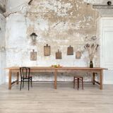 Solid wood workshop table with straight legs.