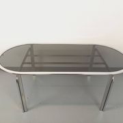Vintage oval dining table in smoked glass and chrome metal, Space Age style.