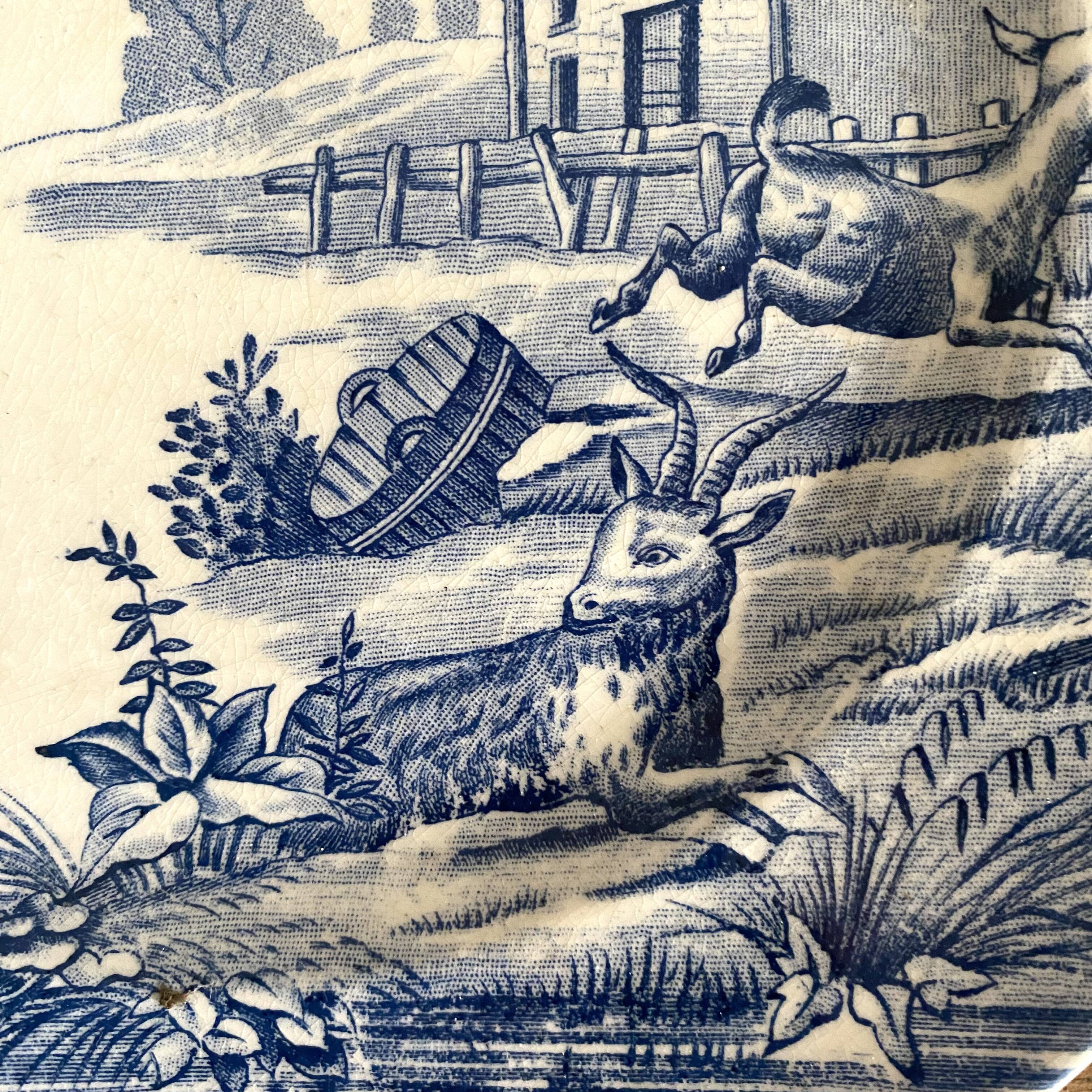 "Rustic" iron earth plate with goats