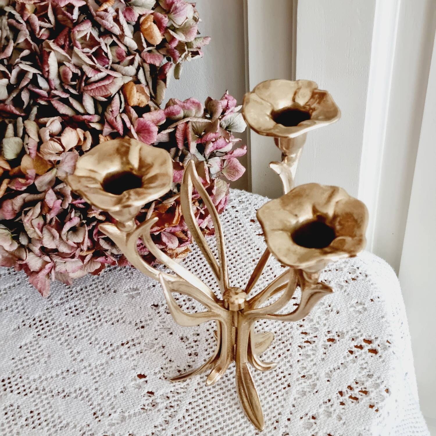 Tall brass flower candlestick