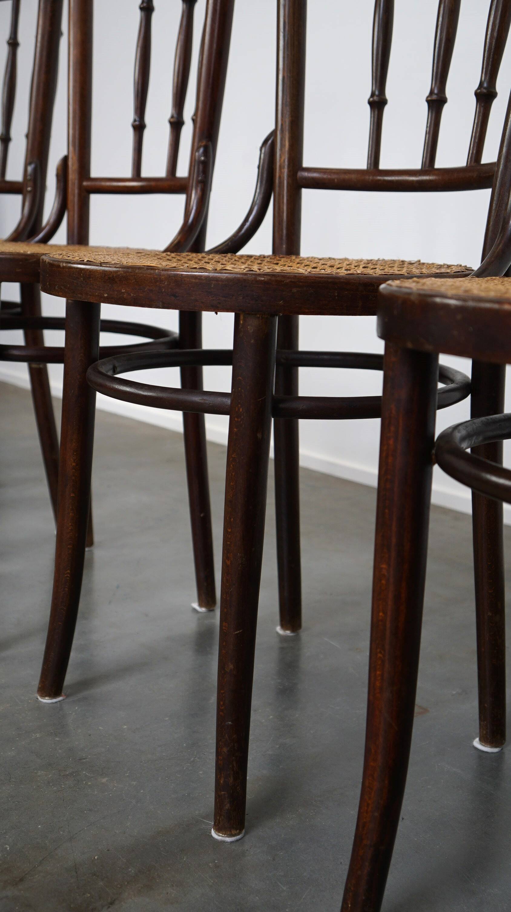 4 antique wooden and cane bistro chairs