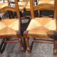 Set of 6 oak dining chairs with high backs and straw seats