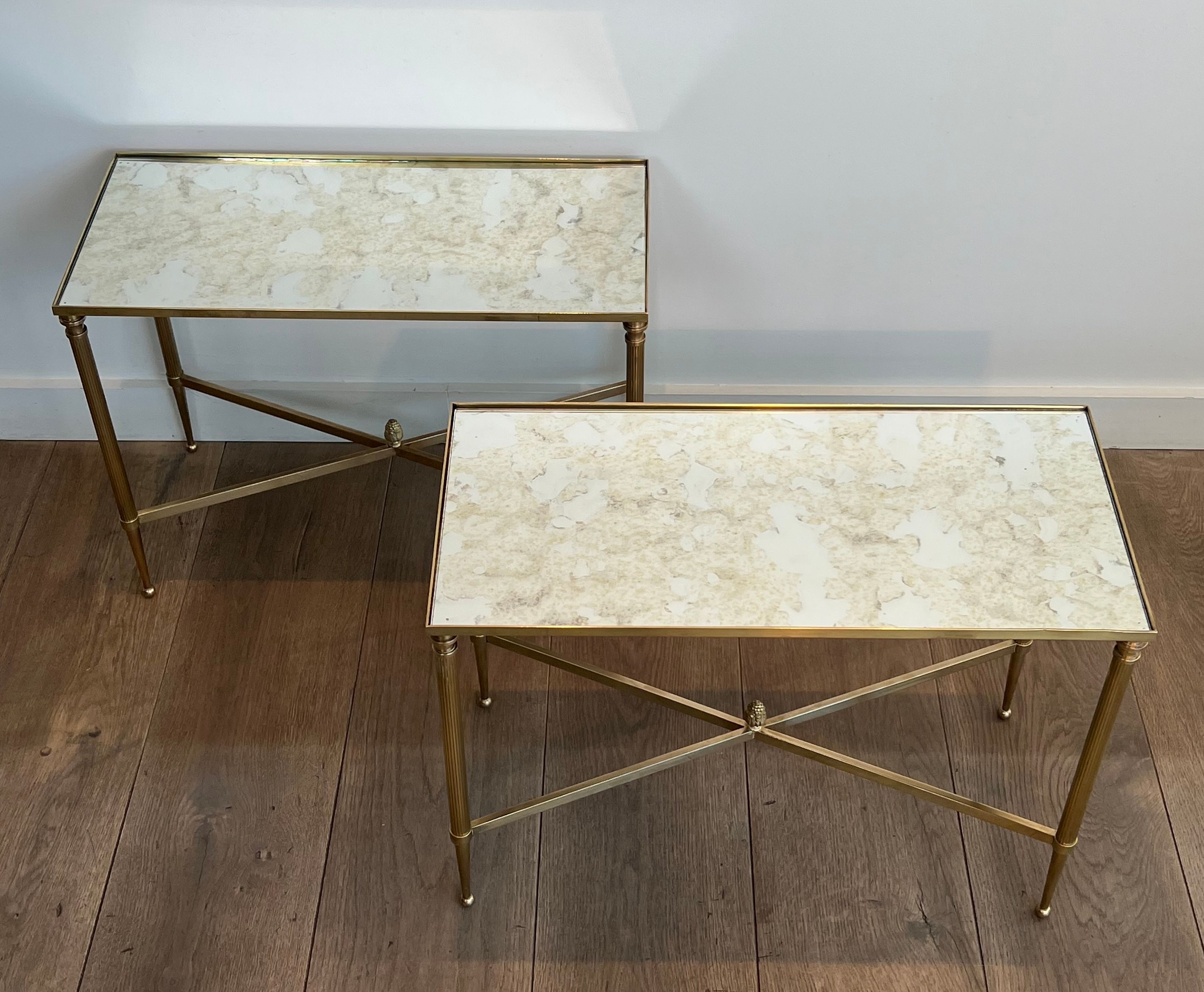 Pair of brass side tables with antique mirrored tops from Maison Jansen