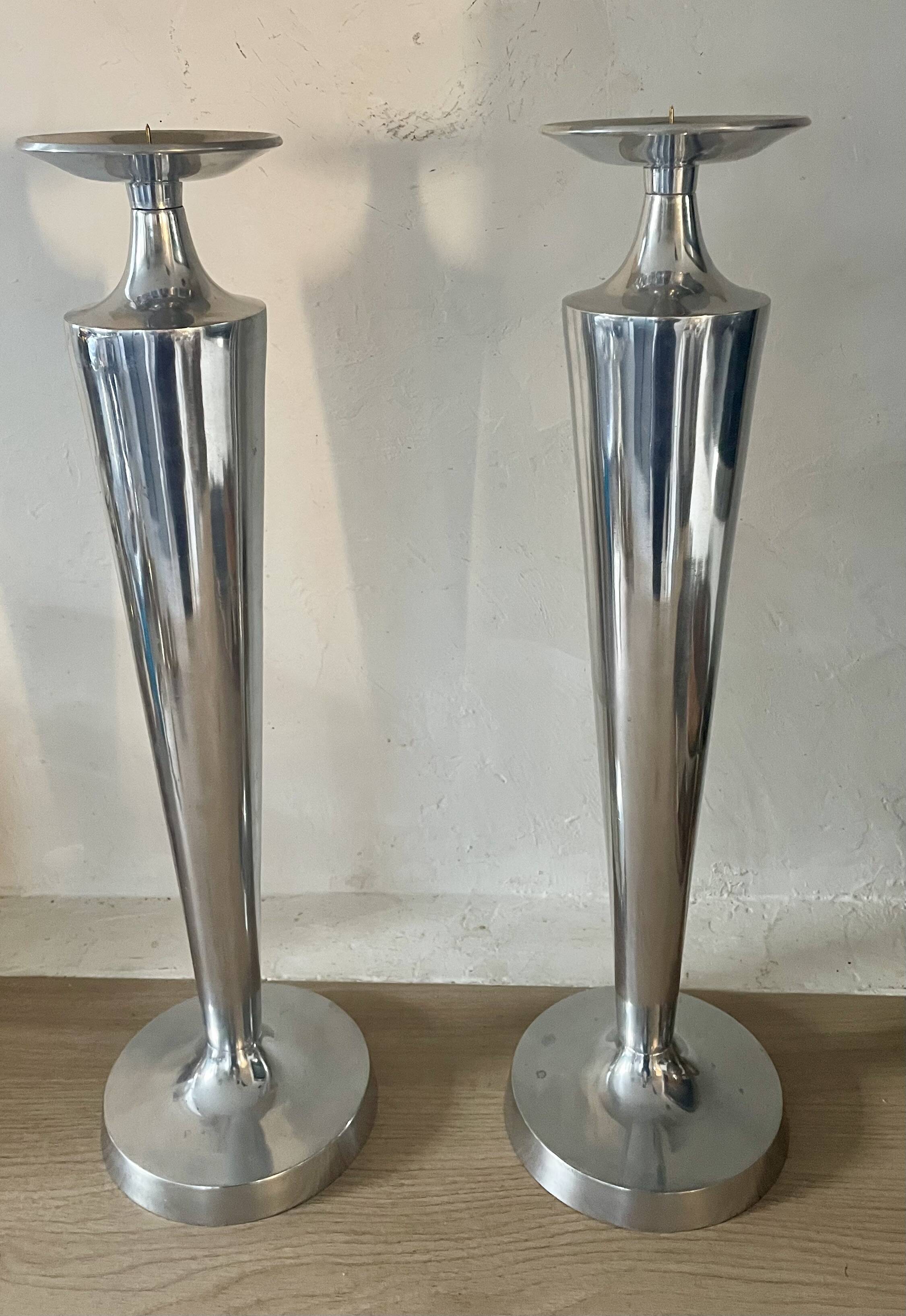 Pair of aluminium cast candle holders 52cm