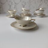 Set of mismatched fine porcelain cups signed with saucer