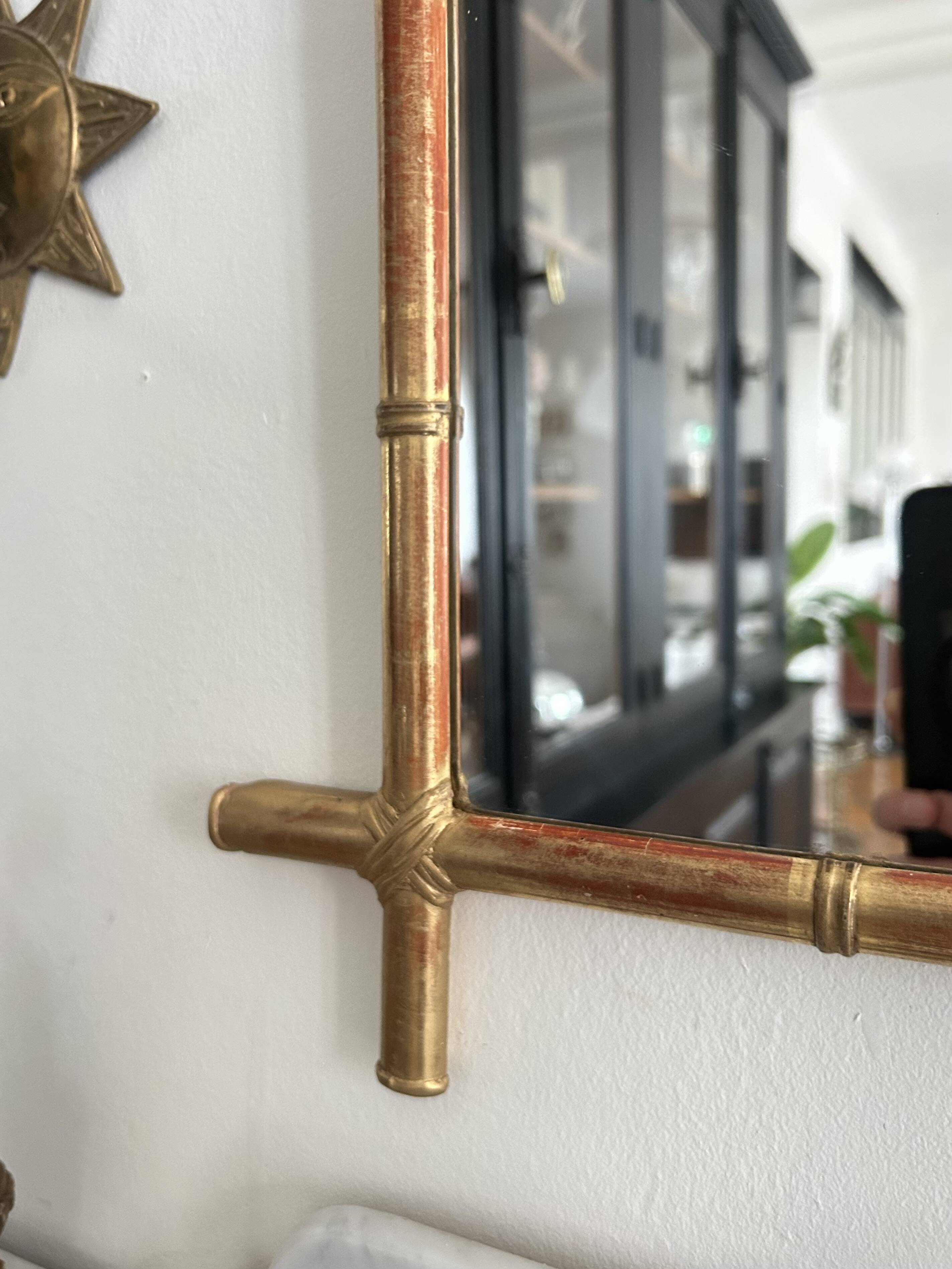 Mirror in gilded stucco, bamboo patina and gold leaf.