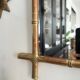 Mirror in gilded stucco, bamboo patina and gold leaf.