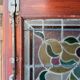 Late 19th century store doors, haberdashery front with Art Nouveau stained glass windows