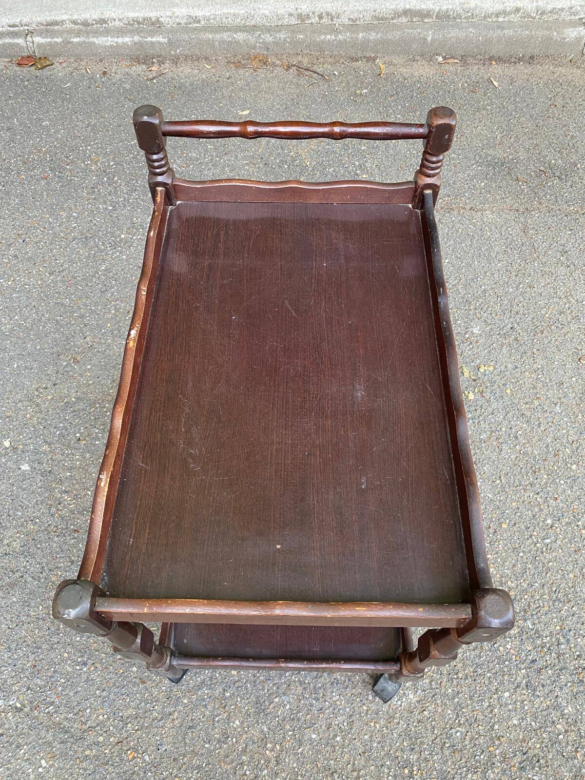 Solid wood serving trolley on wheels