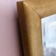 Petit miroir ancien en bois doré et glace biseautée