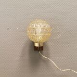 Wall light in rosewood with bobble glass ball shade.