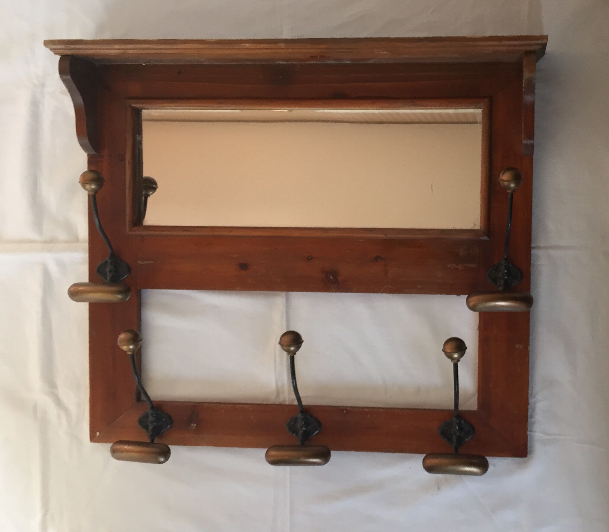 Old wood and brass coat rack