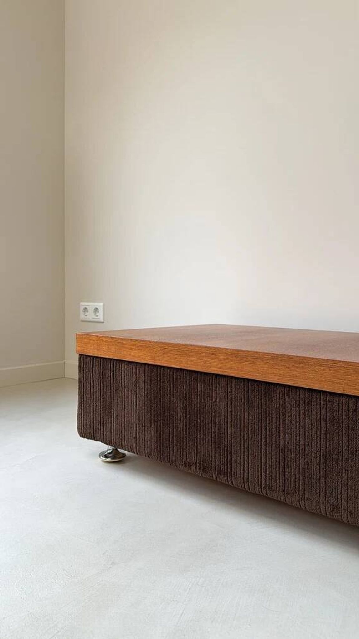 Coffee table with brown corduroy fabric, wooden top and chrome legs