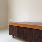 Coffee table with brown corduroy fabric, wooden top and chrome legs