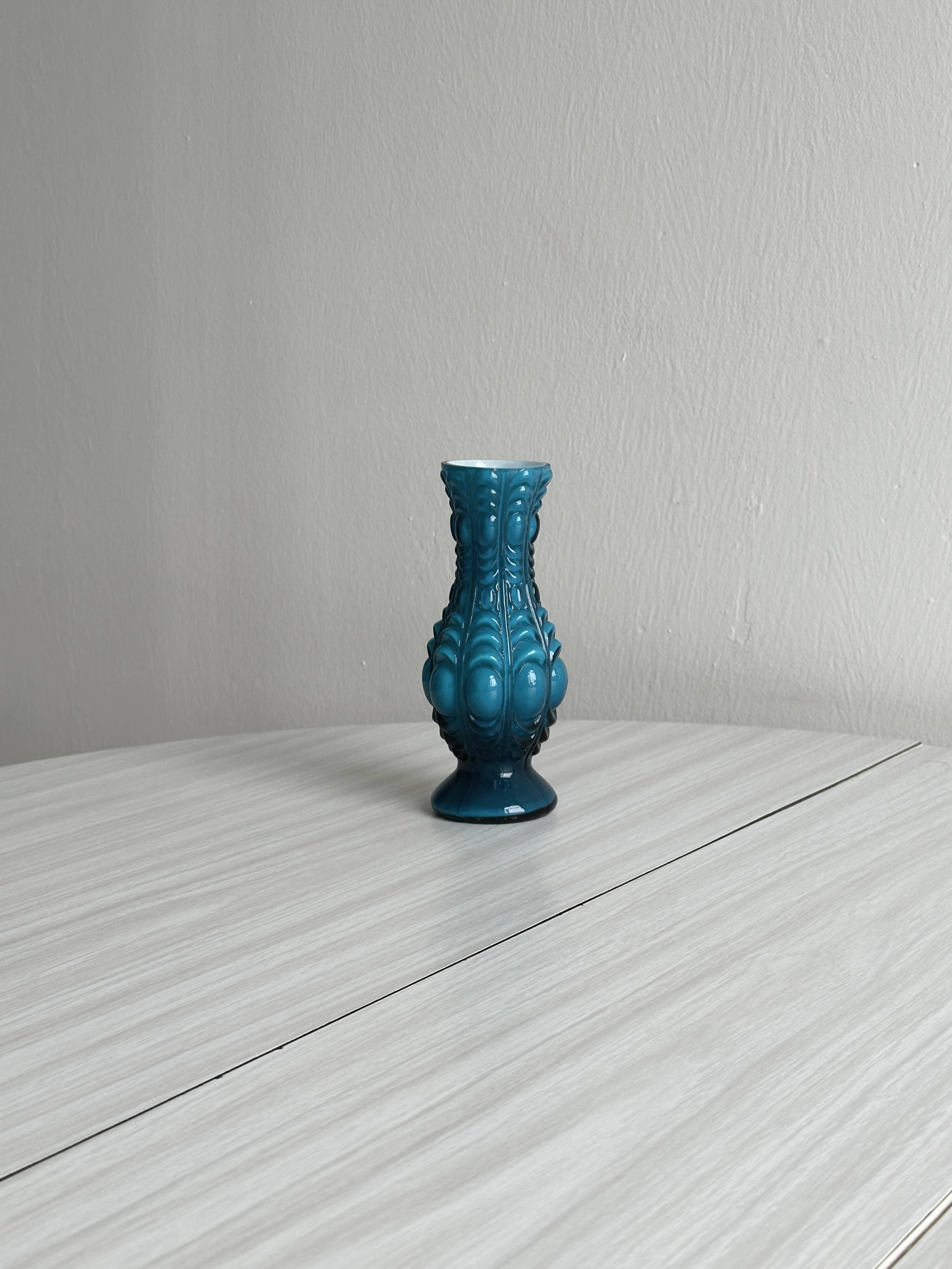 Small deep blue vase with reliefs