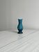 Small deep blue vase with reliefs