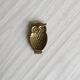 Gold metal owl pocket emptier