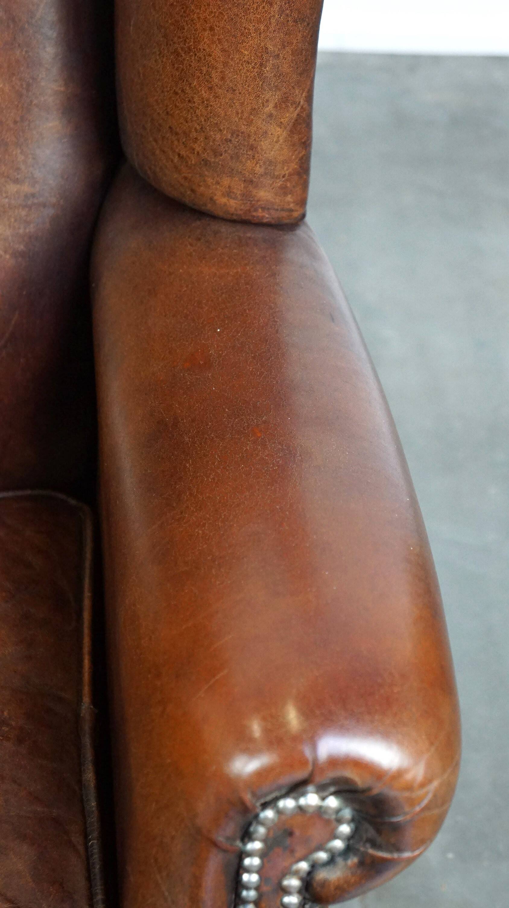 Large sheepskin wing chair with excellent colour and great seating comfort