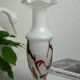 Corolla vase in white opaline with orange-brown patterns.