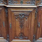 Antique rococo sideboard with integrated clock.
