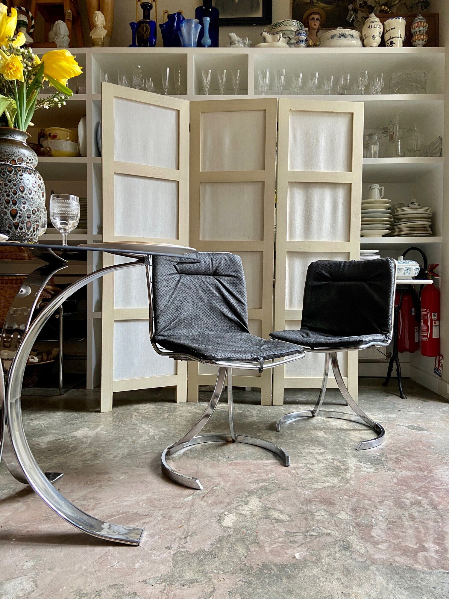 2 chairs in chromed metal and black woven skaï 1970s