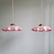 Pair of clear and pink satin glass scalloped pendant lights, 1920s-30s
