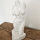 Sculpture of a female torso in white marble.