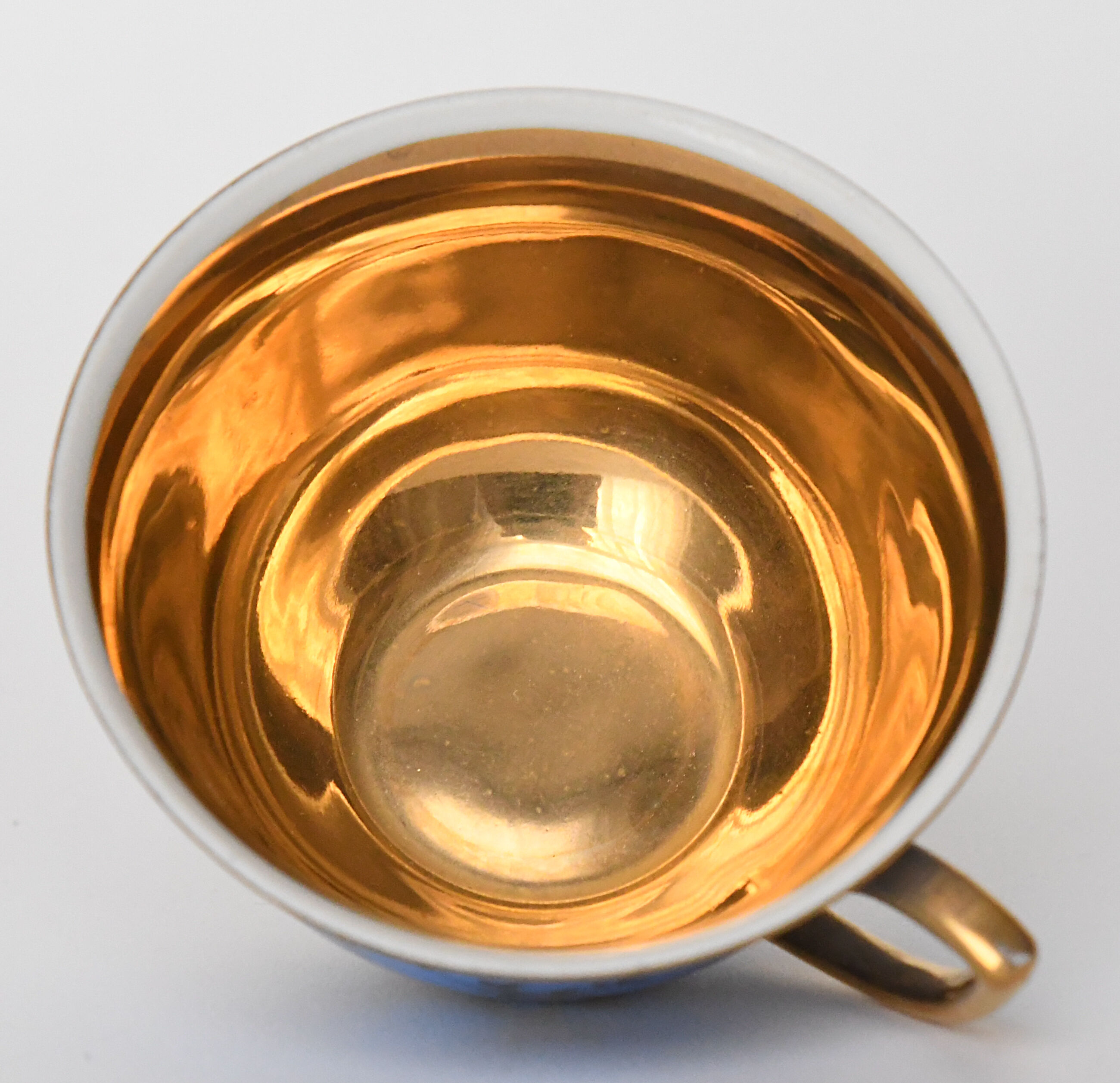 Porcelain cup and undercup