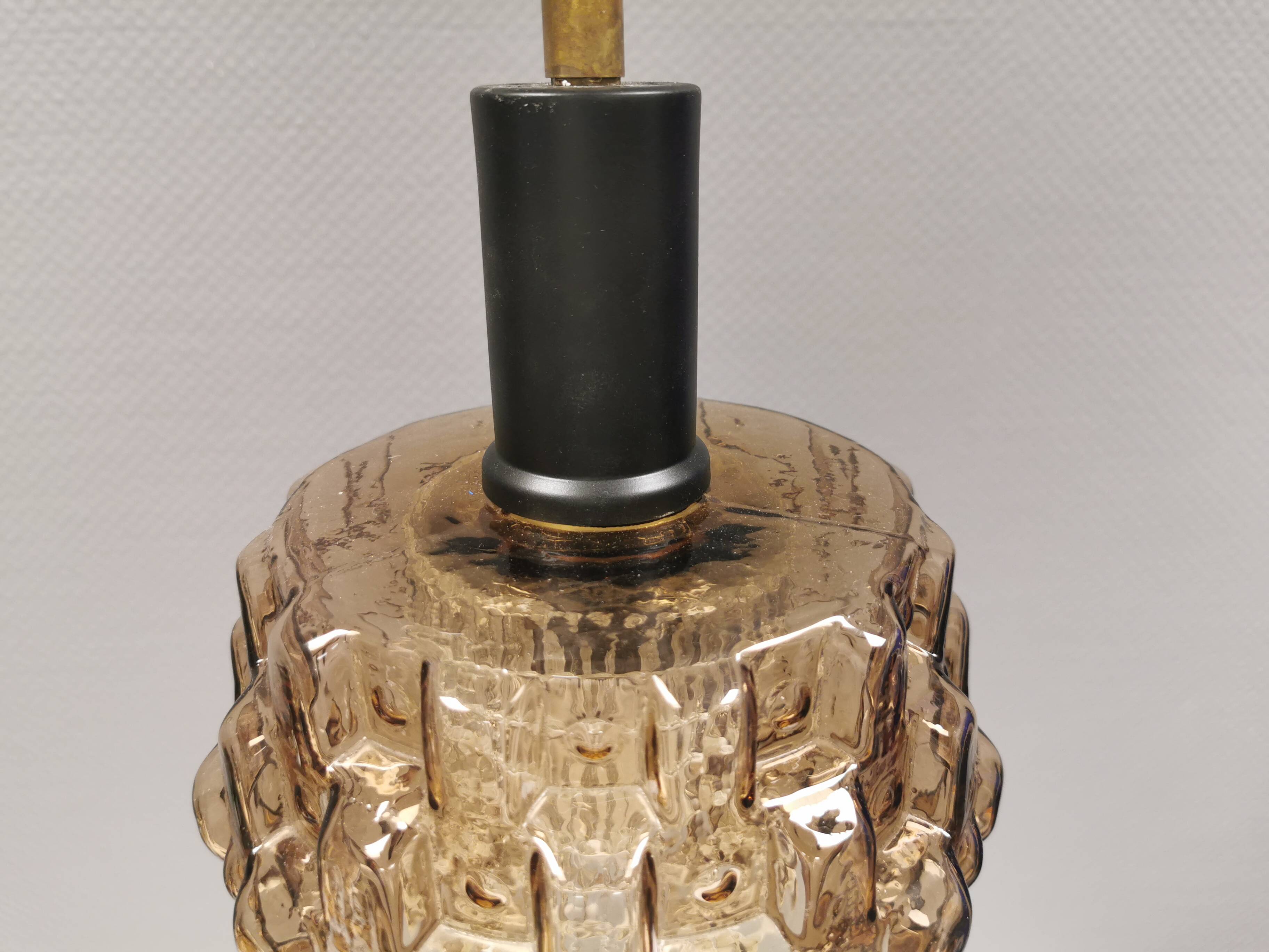 Older hanging lamp with champagne colored outer glass with inner shade of crystal glass.