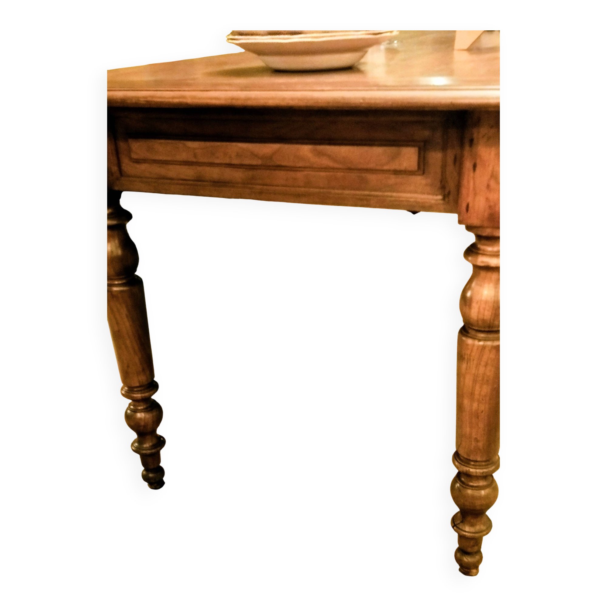 Old French farmhouse table in walnut with turned legs.