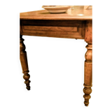 Old French farmhouse table in walnut with turned legs.