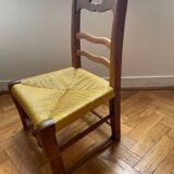 Low chair in wood and woven straw