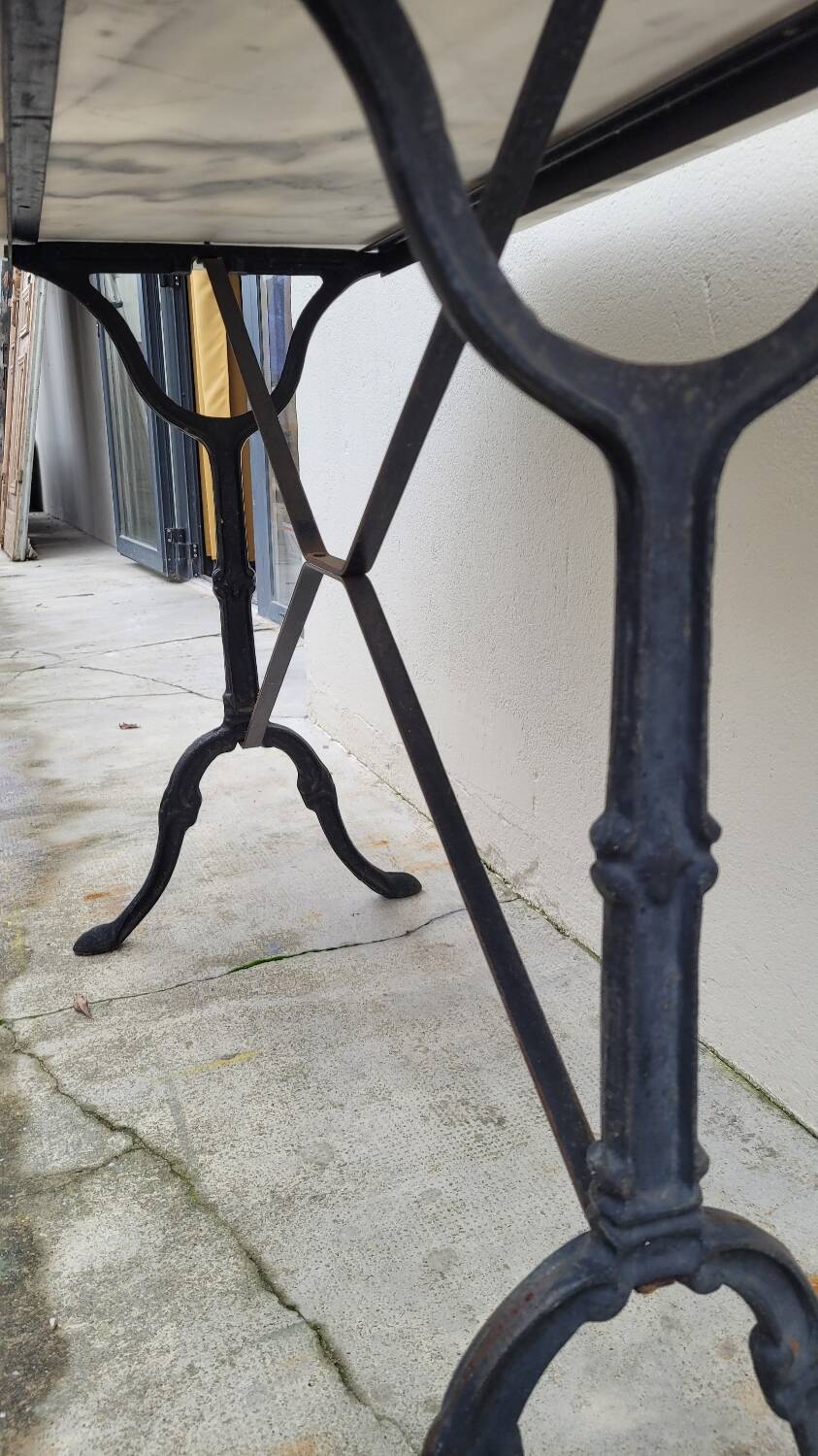 Antique cast iron bistro table with oval marble top