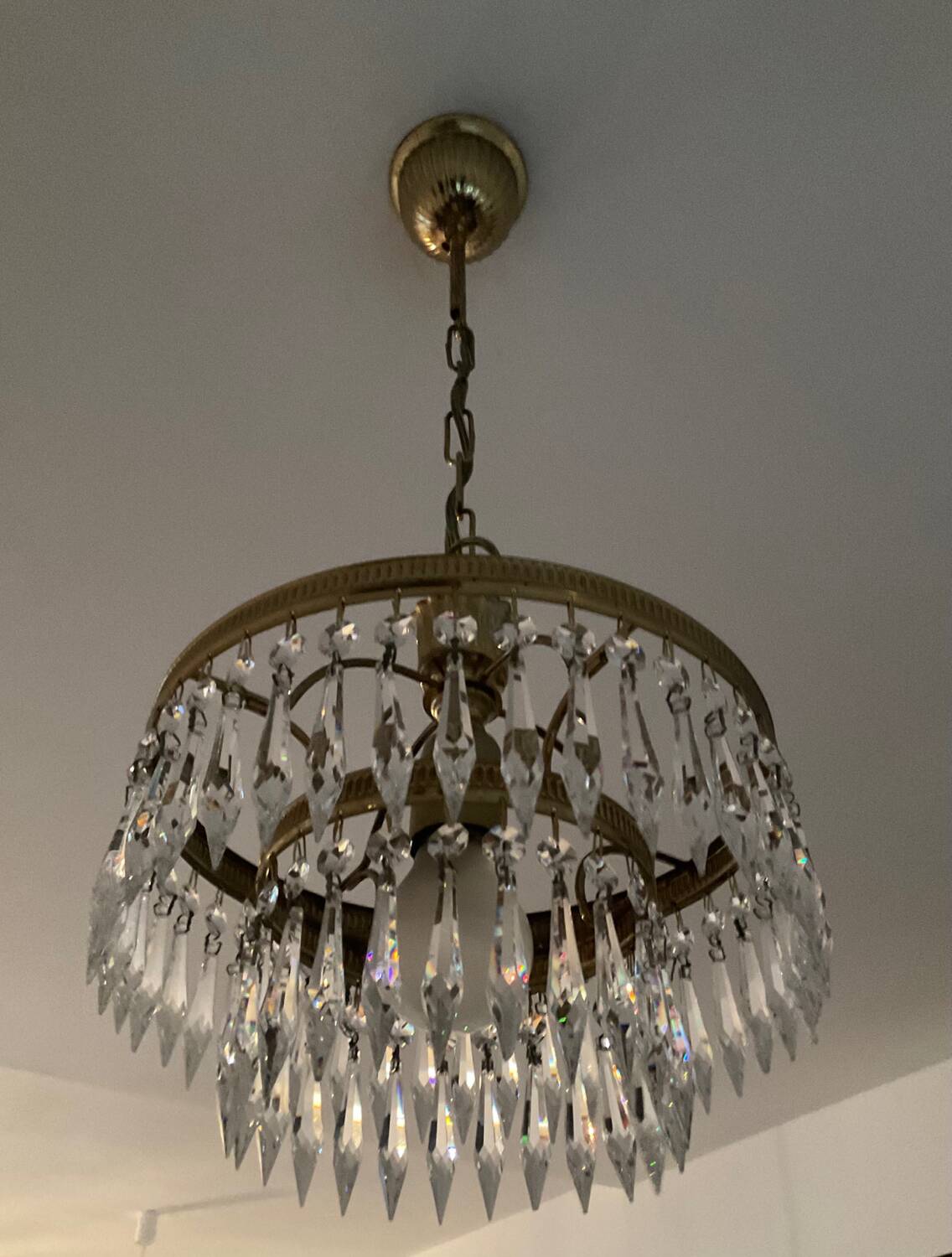 Cascade chandelier with crystal and brass tassels