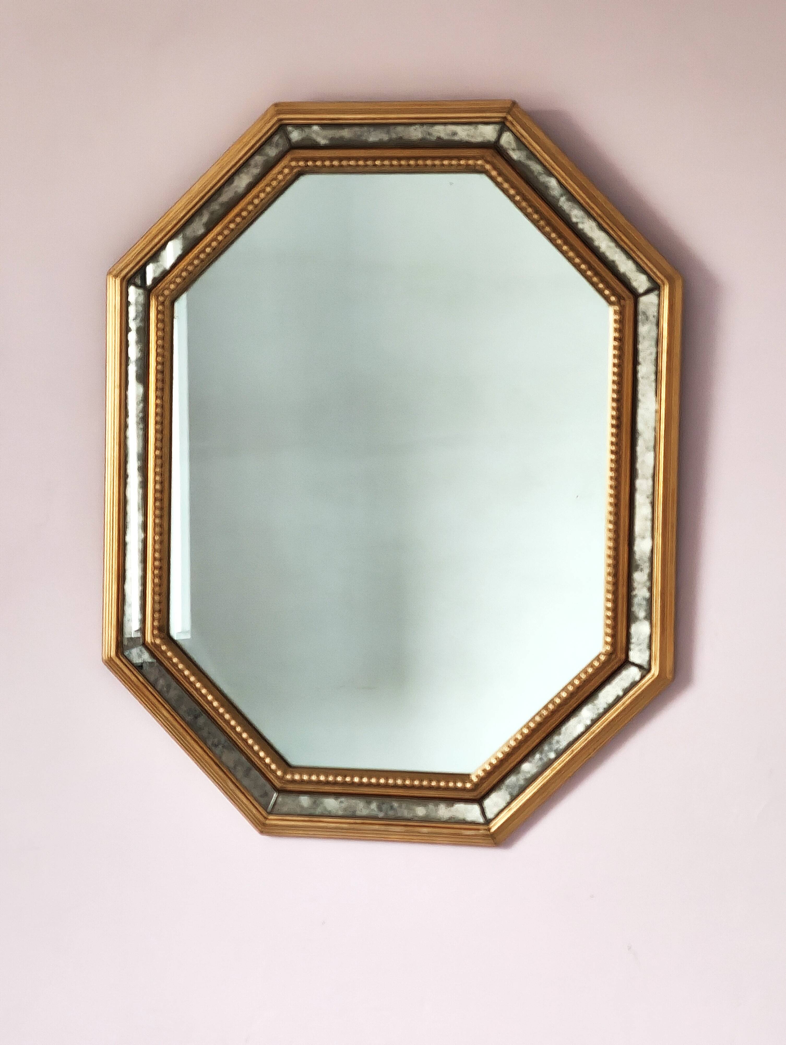 Antique mirror with gilded wooden frame.