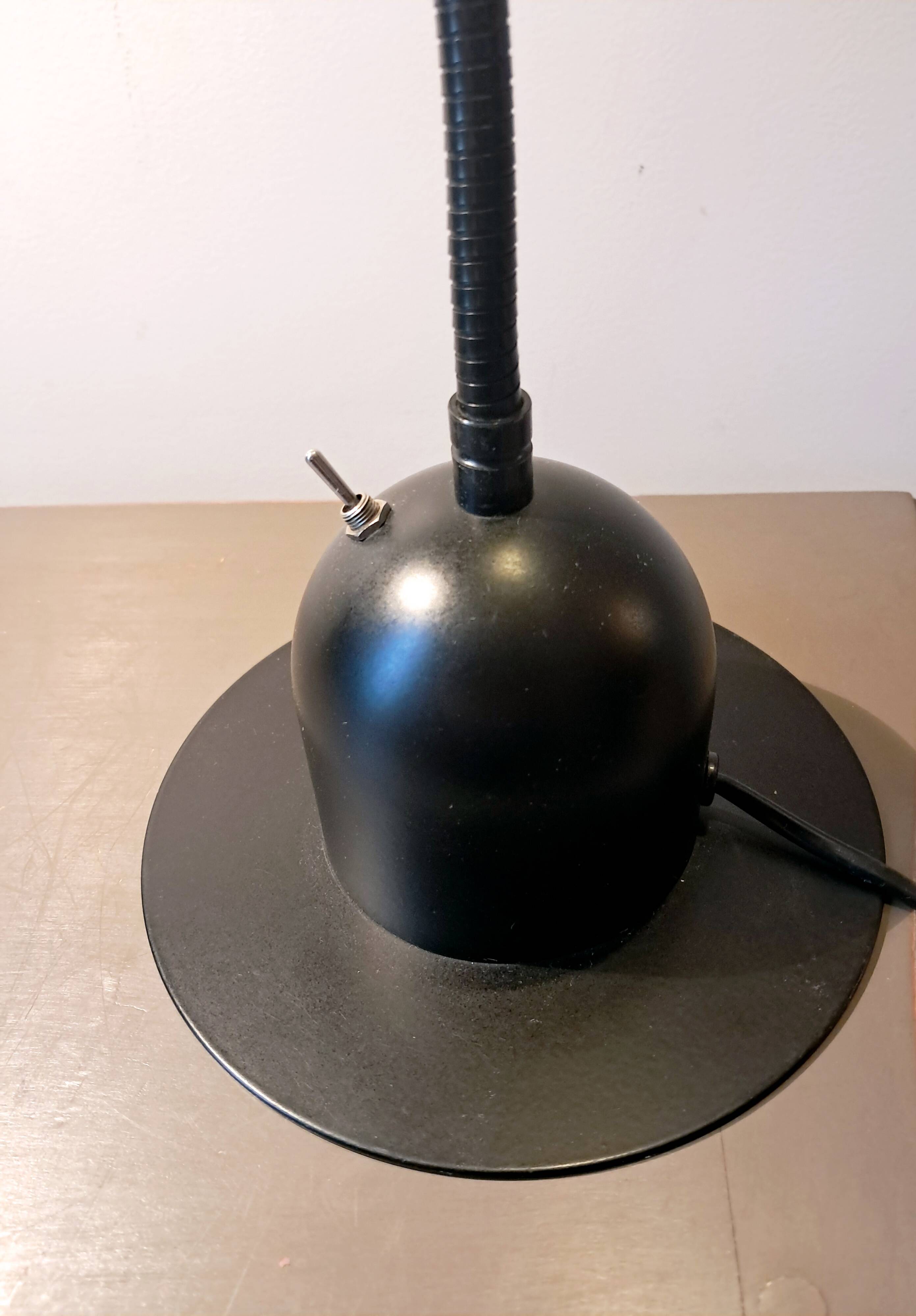 Articulated lamp in black metal. 80s