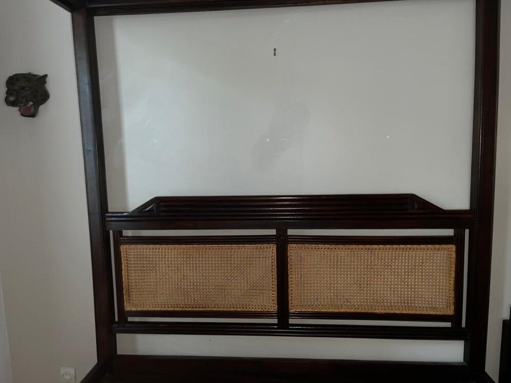 Exotic wood four-poster bed colonial style with rattan headboard