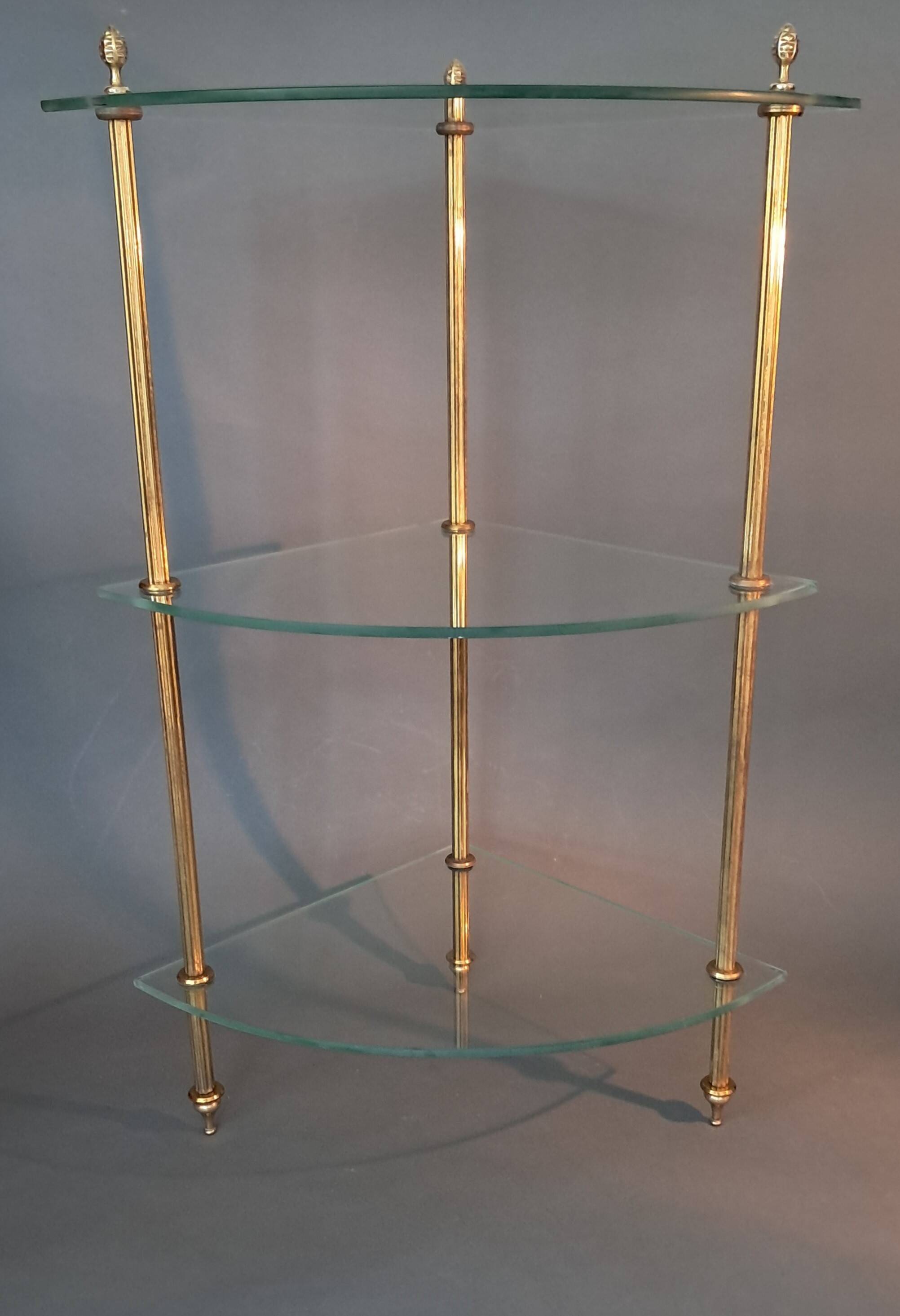 Neoclassical style 3-shelf corner cupboard in gilded brass, Circa 1950/1960.