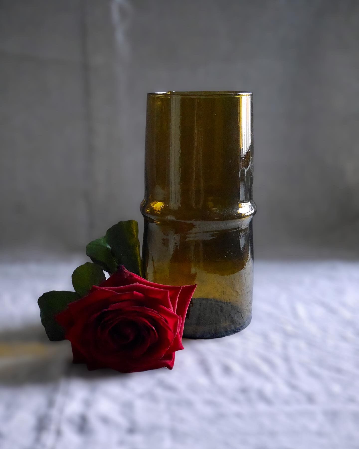 Cylindrical amber glass vase