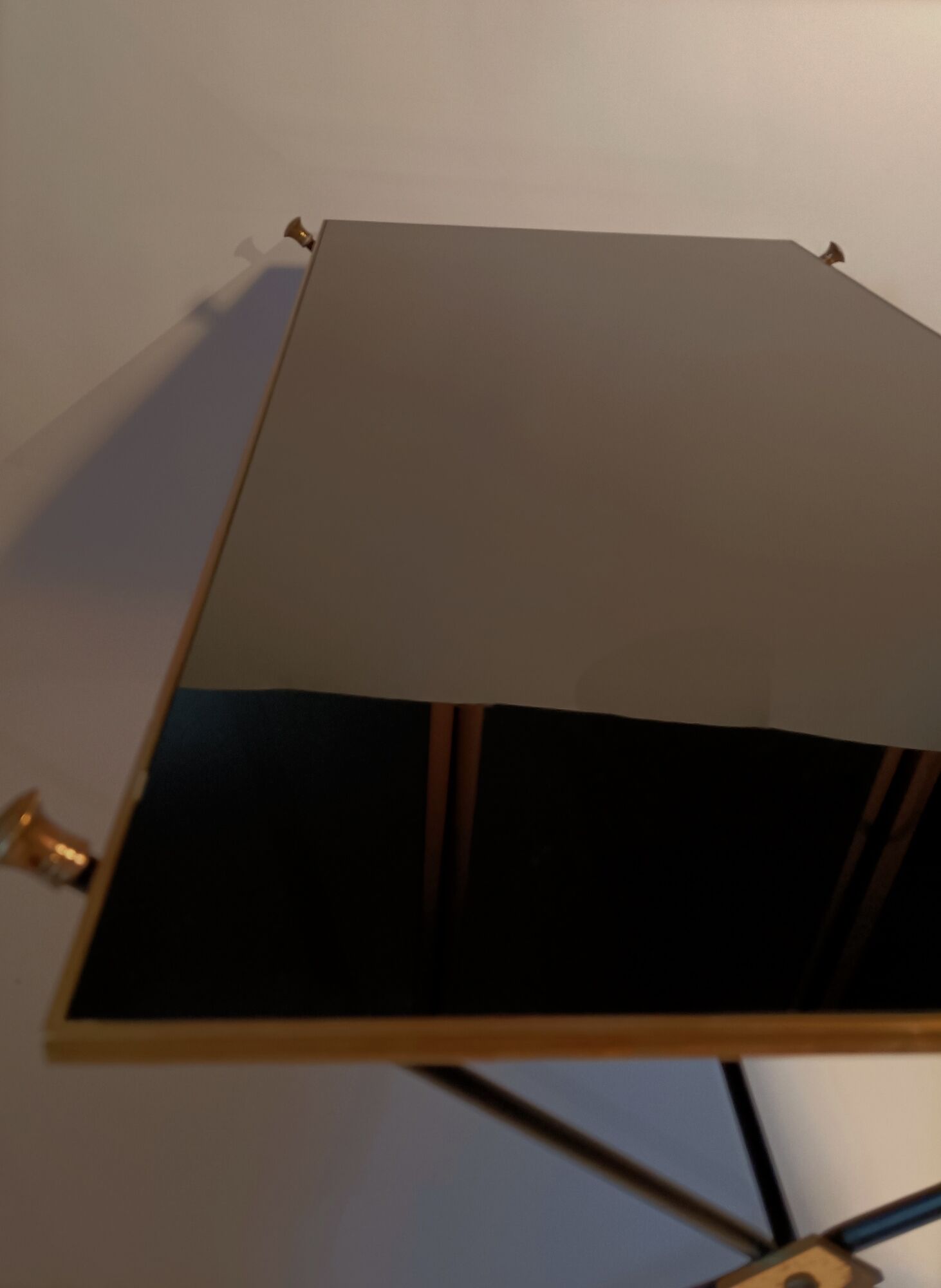 Coffee table in gilded brass, black metal and black opaline top, circa 1950
