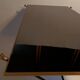 Coffee table in gilded brass, black metal and black opaline top, circa 1950