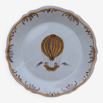 18th century Nevers earthenware plate with hot air balloon pattern