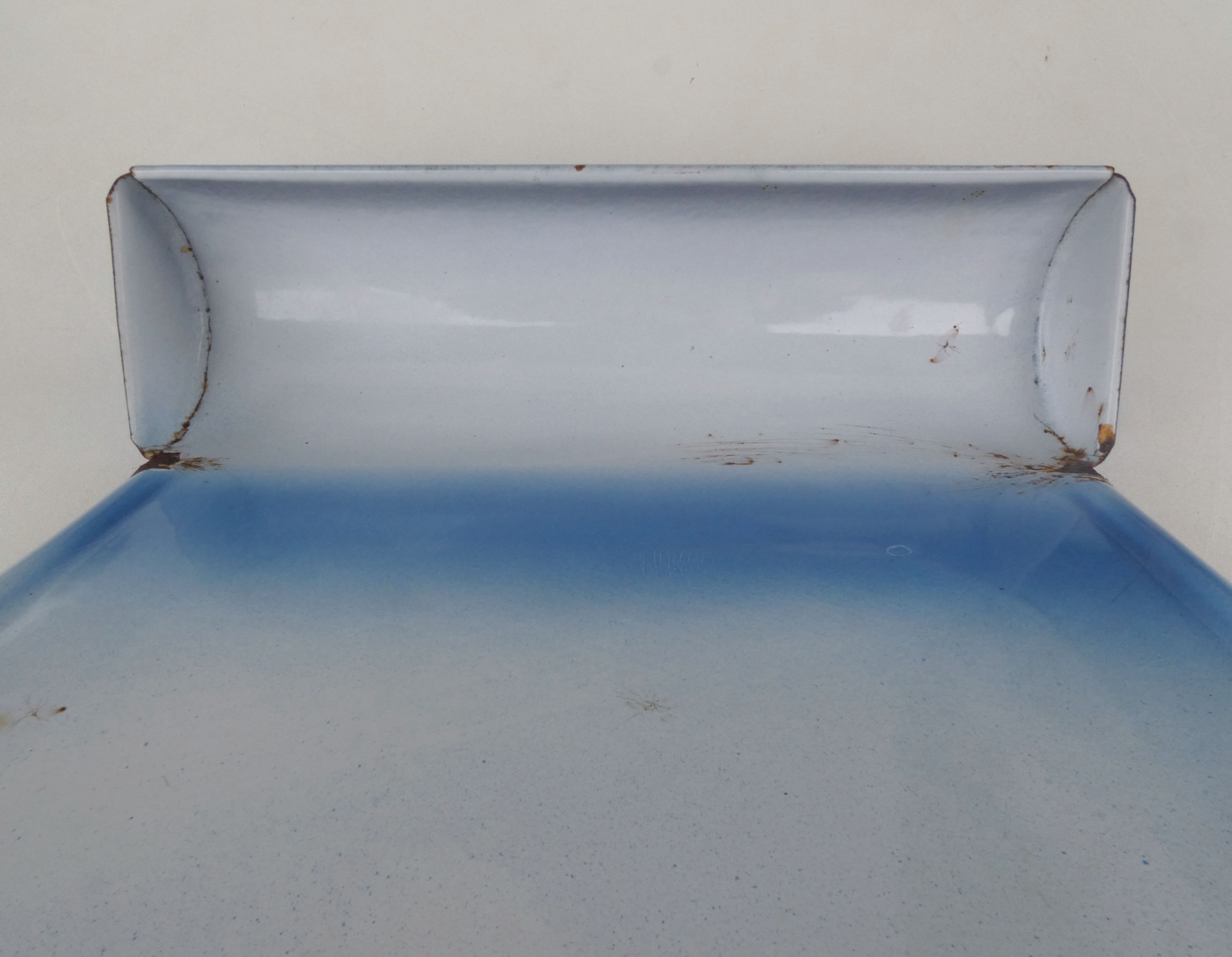 old blue enamelled steel utensil drainer