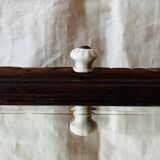 Old carved wooden medicine cabinet with beveled mirror